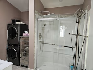 Shower, hair dryer, towels, soap