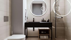 A modern bathroom with a toilet, sink, mirror, and shower. - Novotel Hamburg Hafencity (Hamburg)