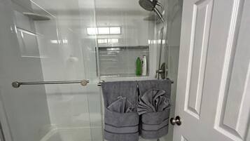 Shower, hair dryer, towels, soap