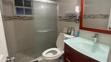 Shower, hair dryer, towels, soap