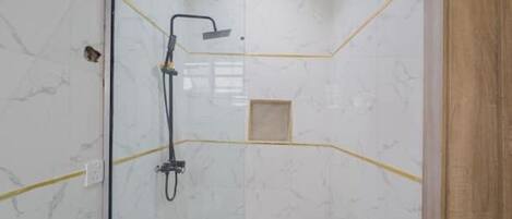 Shower, hair dryer, towels, toilet paper