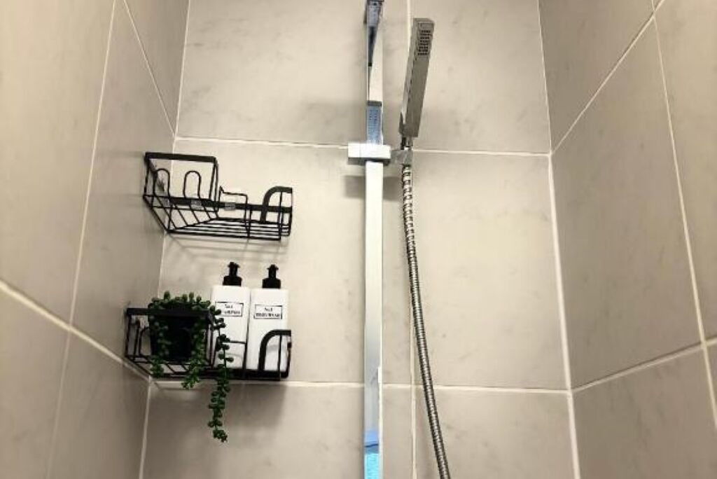 Shower, hair dryer, towels, toilet paper