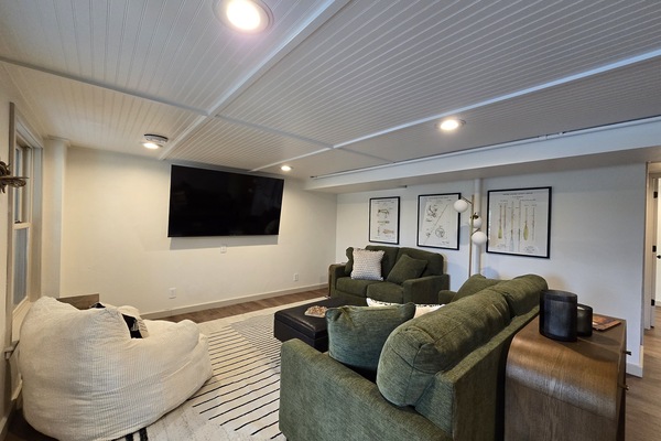 - Relax in this cozy living room with plush seating - Enjoy the big-screen TV and bright inviting layout - Perfect lounge spot for movie nights and group fun