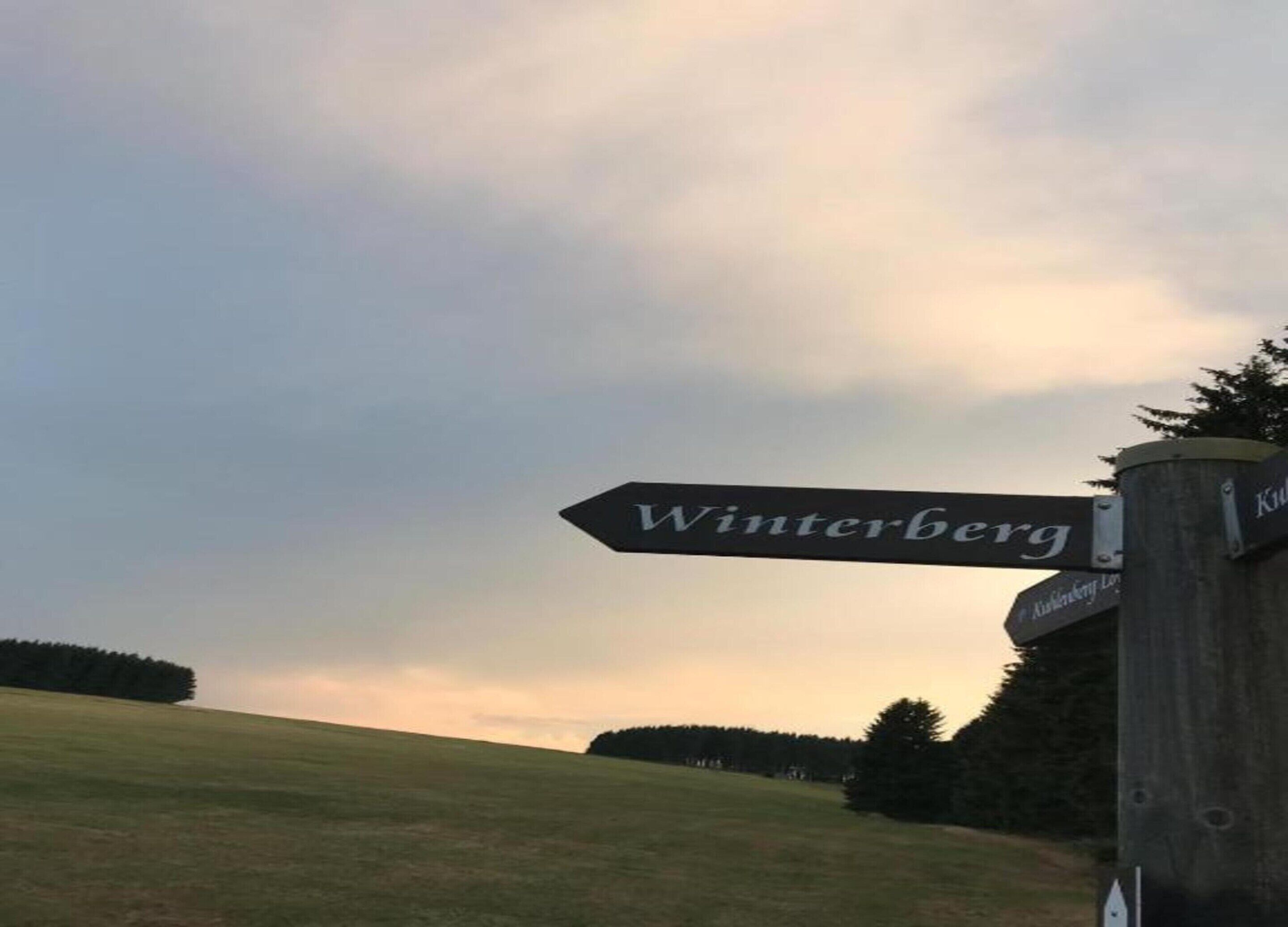 A directional sign for Winterberg.
