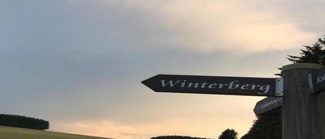 A directional sign for Winterberg.