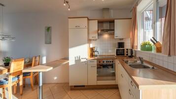 Apartment | Private kitchen | Electric kettle, toaster, high chair