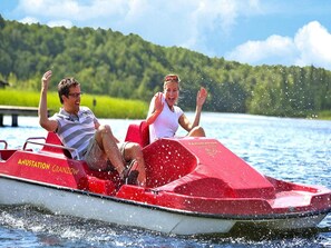 Ride a jet ski across the calm waters of this serene lakeside setting.