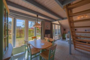 Enjoy meals in this inviting dining area with a large table and comfortable seating.