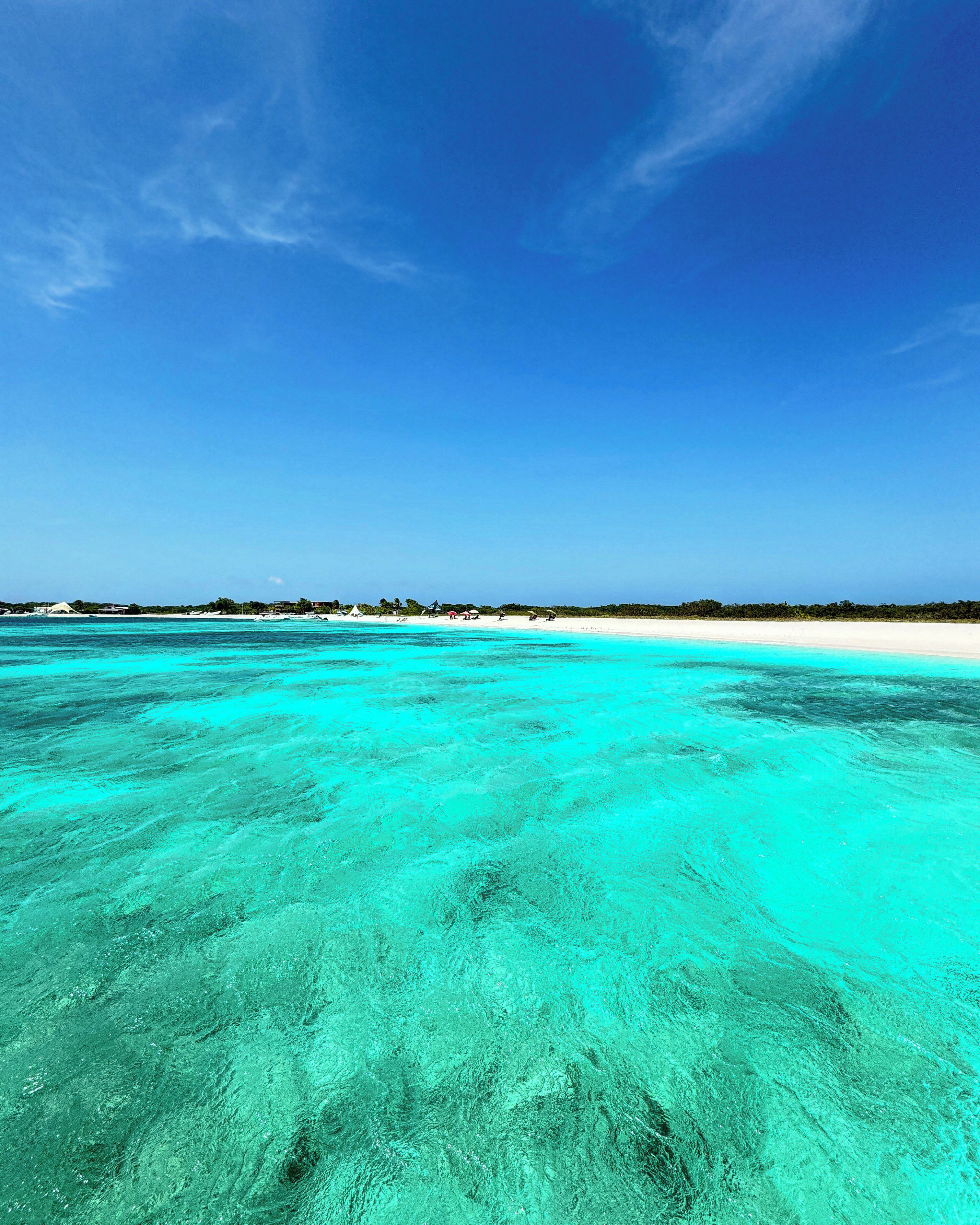 Beach nearby, white sand, beach umbrellas, beach towels