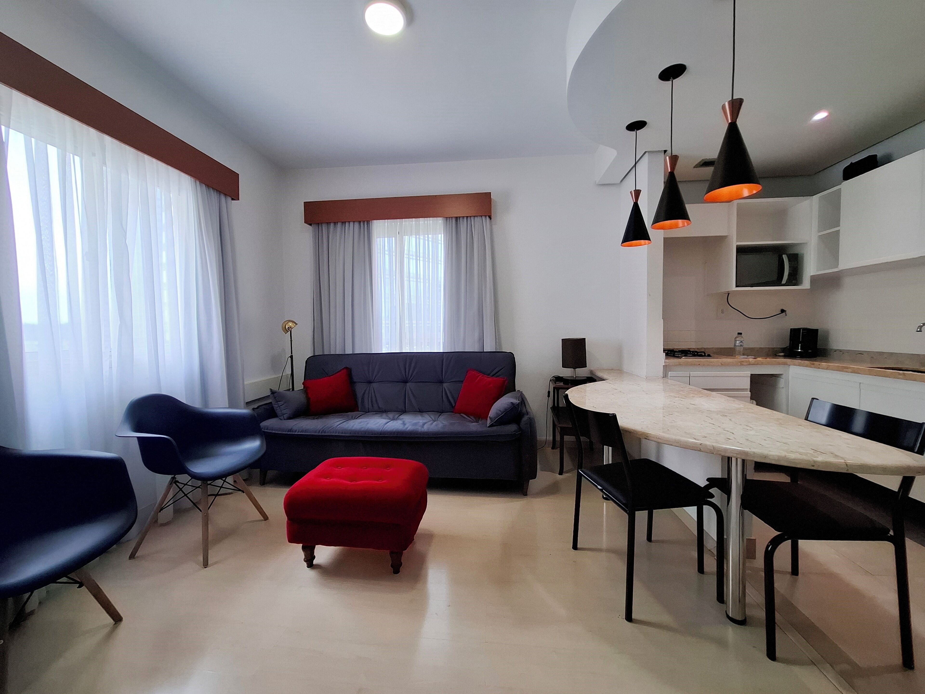 Departamento familiar, 1 cama Queen size y sofá cama | Sala de estar | Televisión LED de 40 pulgadas con canales por cable 