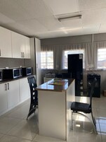 Family Room, Balcony, Garden View | Private kitchen