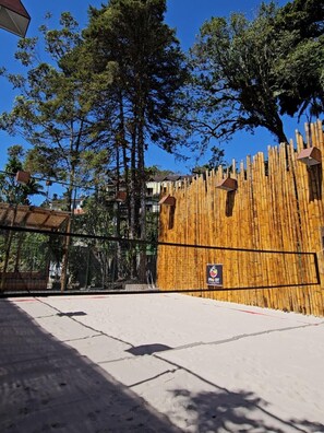 A fenced area with a bamboo wall and a sign indicating a ProBet facility.