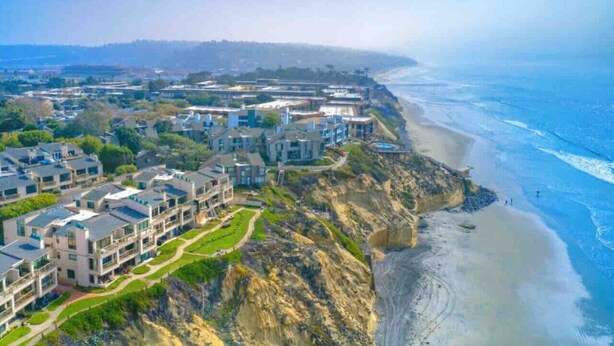 A coastal residential area with modern houses and a beach. - BreathTaking View of Ocean Blue and Orange Sunsets (Solana Beach)