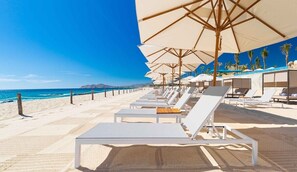 On the beach, sun-loungers, beach towels