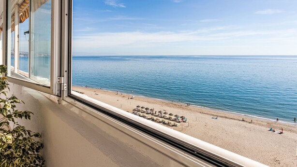 A beach view from a window with a clear sky and calm sea. - Capitan by Interhome (Fuengirola)