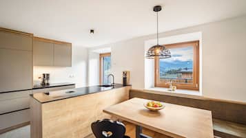 Fridge, stovetop, dishwasher, coffee/tea maker