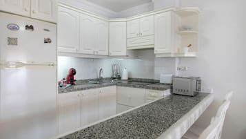 Fridge, microwave, stovetop, coffee/tea maker