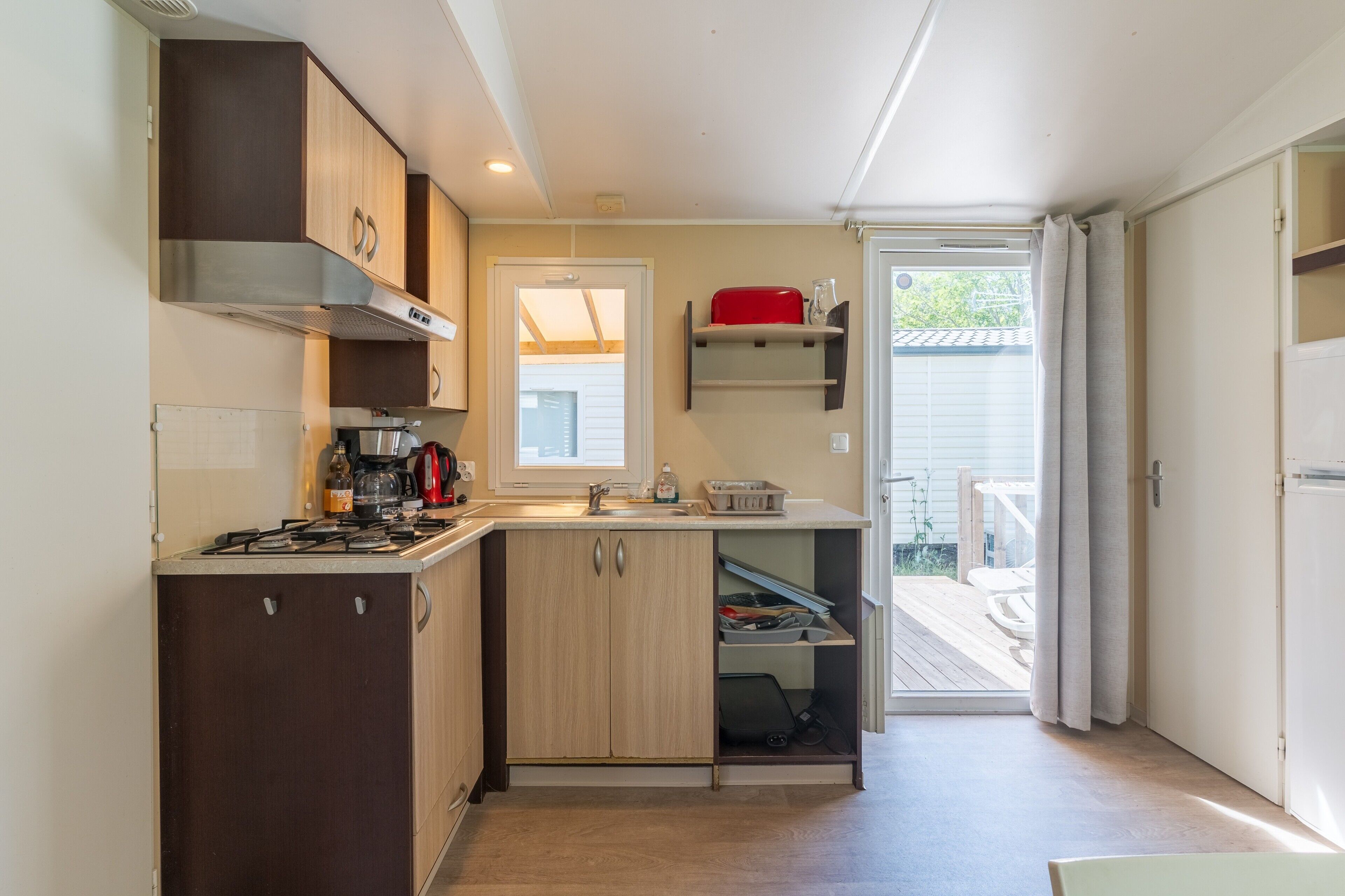 Fridge, microwave, stovetop, coffee/tea maker