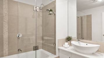 Shower, hair dryer, towels, toilet paper