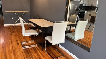 Basic Single Room, 1 Bedroom | Living area | Flat-screen TV