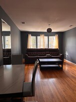 Basic Single Room, 1 Bedroom | Living area | Flat-screen TV