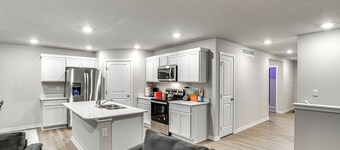 1 Mi to Golf: Quiet Waukee Home w/ Fireplace!