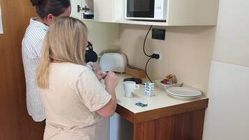 Mini-fridge, microwave, toaster, dining tables