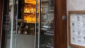 A storefront with a sign reading "LEONIE" and a display window showcasing various products. - Very bright. 1 bedroom Batignolles / Opera. (Paris)