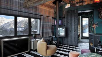 A modern interior with a large window, a fireplace, and a cozy seating area.