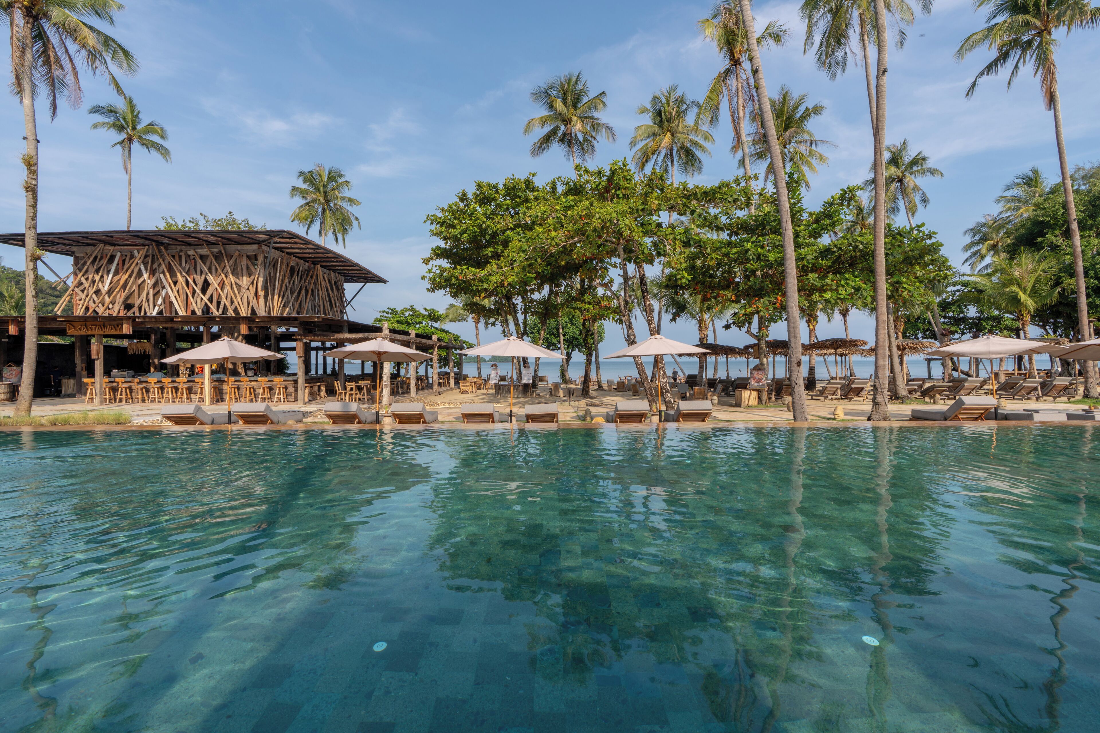 Outdoor pool, free pool cabanas, pool umbrellas