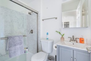 Shower, hair dryer, towels