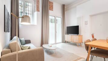 One-Bedroom Apartment with Sofa Bed | Living area | Flat-screen TV