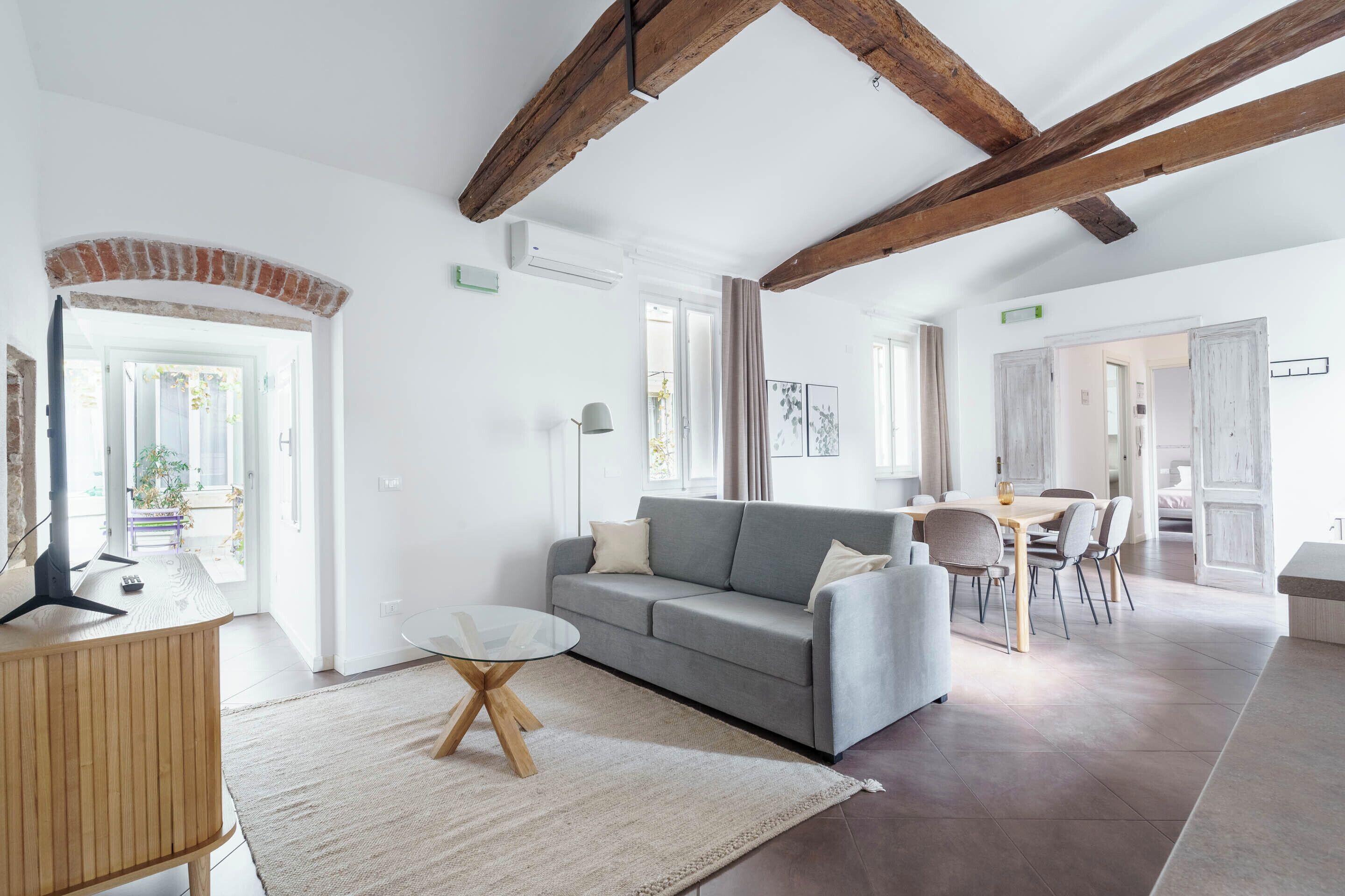 One-Bedroom Apartment with Balcony | Living area | Flat-screen TV