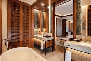 Bathtub, hair dryer, slippers, towels