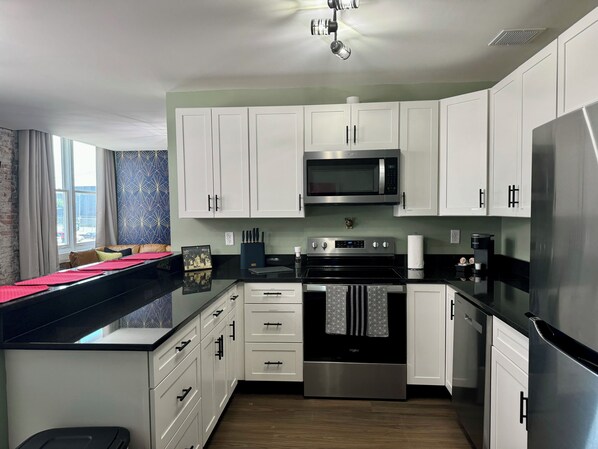Oven, stovetop, coffee/tea maker, cookware/dishes/utensils