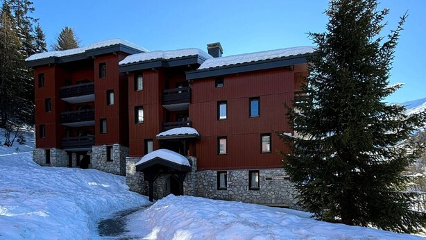 A multi-story building with balconies, stone foundation, and a sign reading "Soldanella". - Apartment with balcony, parking, near La Plagne center (La Plagne 1800)