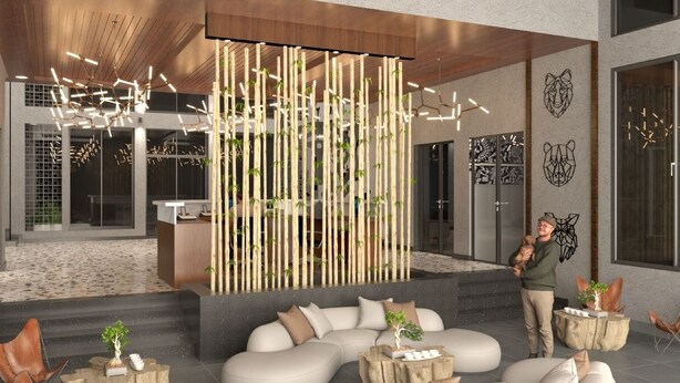 A modern interior with a bamboo divider, seating area, and decorative wall art. - Shiv Ganga Kanha Resort (Baihar)