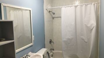 Shower, towels, soap, toilet paper