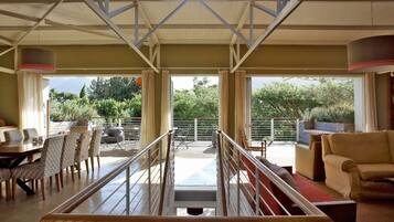 Deluxe House, Garden View | Living area | Flat-screen TV