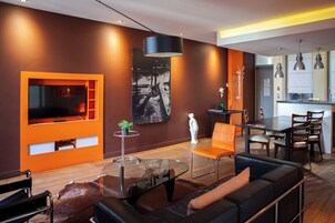 Design Apartment, 2 Bedrooms, Non Smoking | Living area | 28-inch Smart TV with cable channels