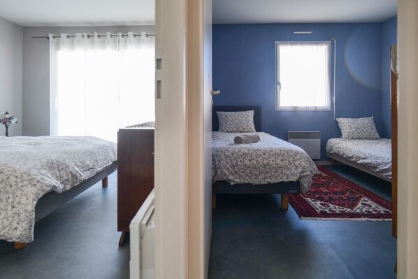 2 habitaciones y tabla de planchar con plancha 