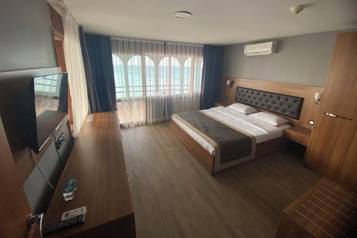 Family Quadruple Room, Balcony, Sea View | In-room safe, desk, laptop workspace, blackout drapes