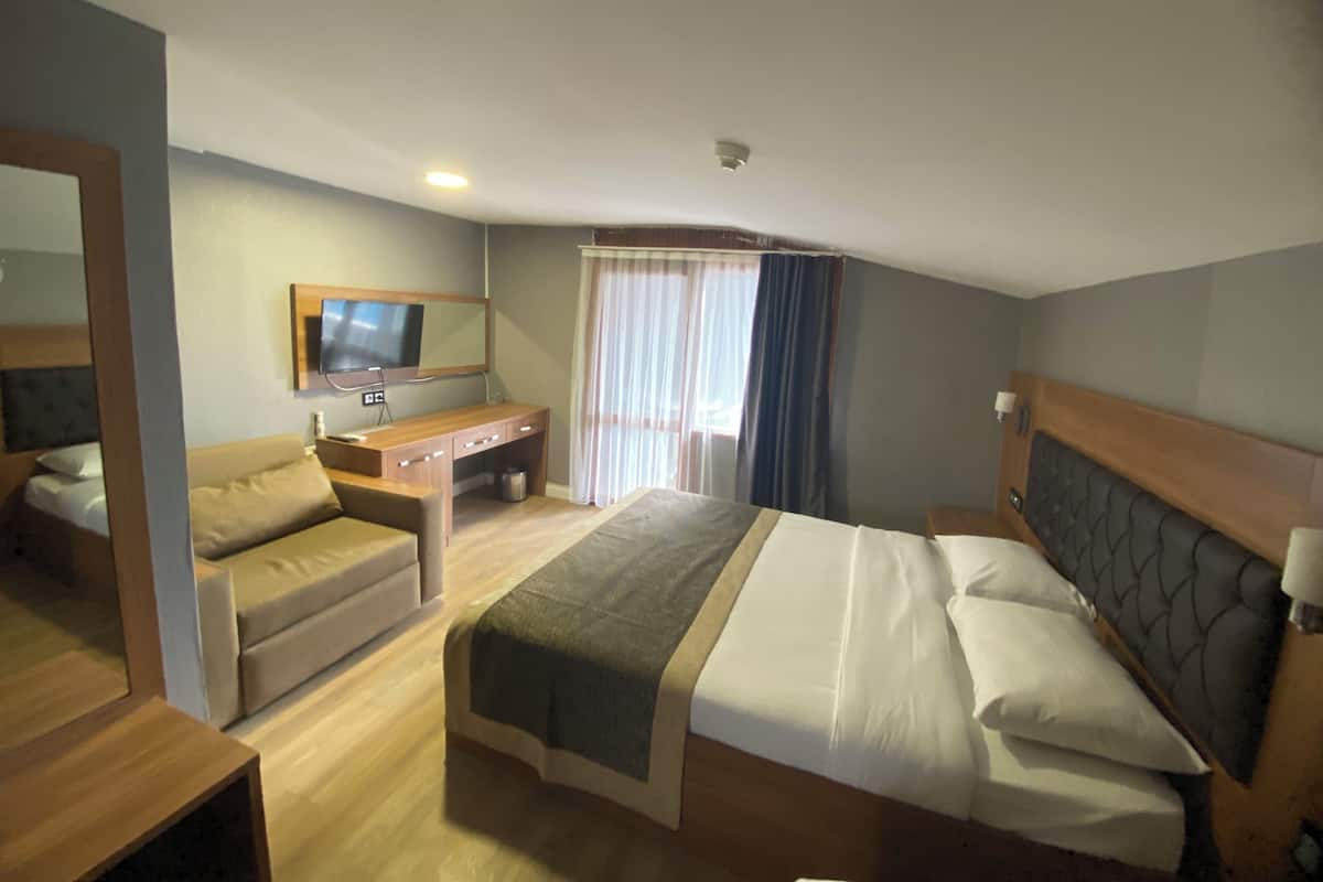 Deluxe Double Room, Balcony, City View | In-room safe, desk, laptop workspace, blackout drapes