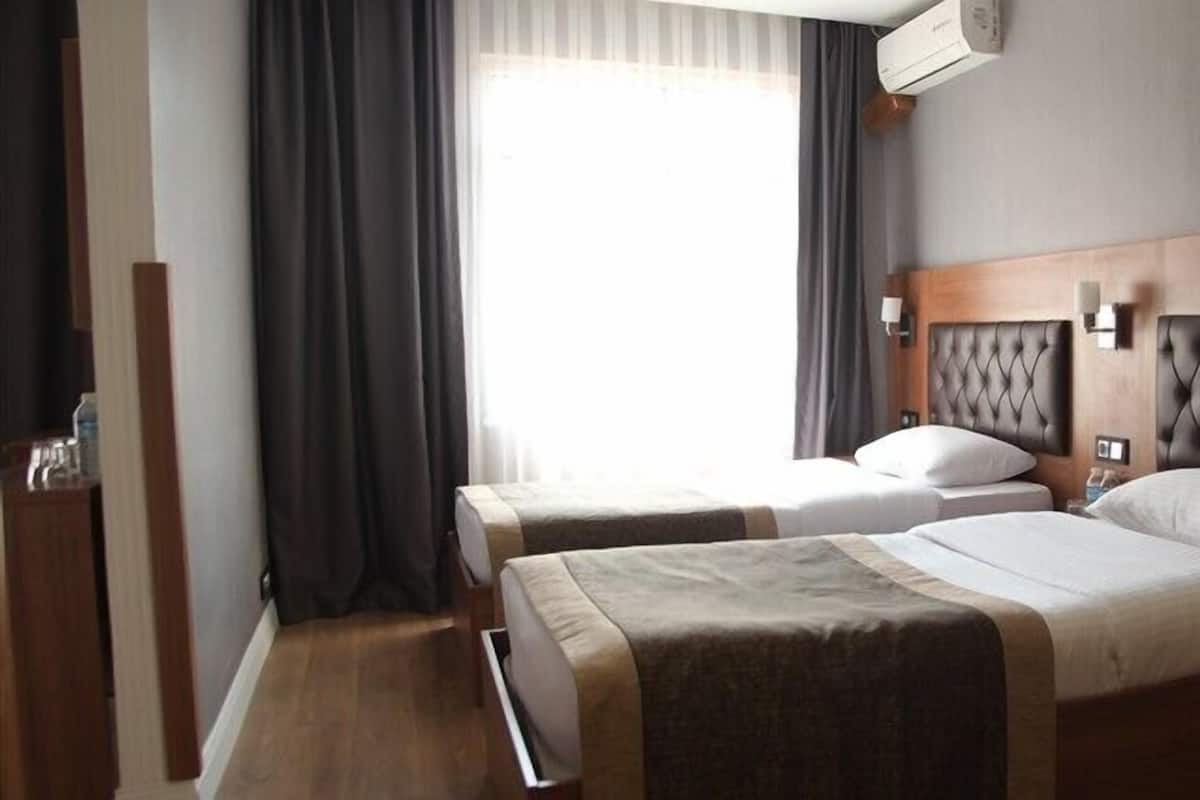 Standard Twin Room, City View | In-room safe, desk, laptop workspace, blackout drapes