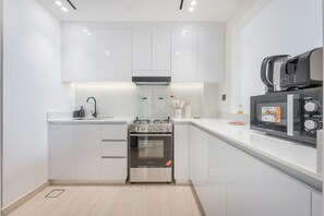 High chair - StayShort - Cozy 1-Bedroom Apartment Perfect for 4 in JVC! (JVC (Jumeirah Village Circle))