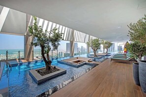 Pool - Free housekeeping visits during your stay - StayShort - Contemporary 2BR Apartment in Business Bay Ideal for 4 (Downtown/Business Bay)