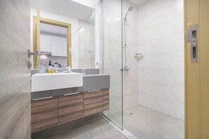 Shower, hair dryer, towels, soap