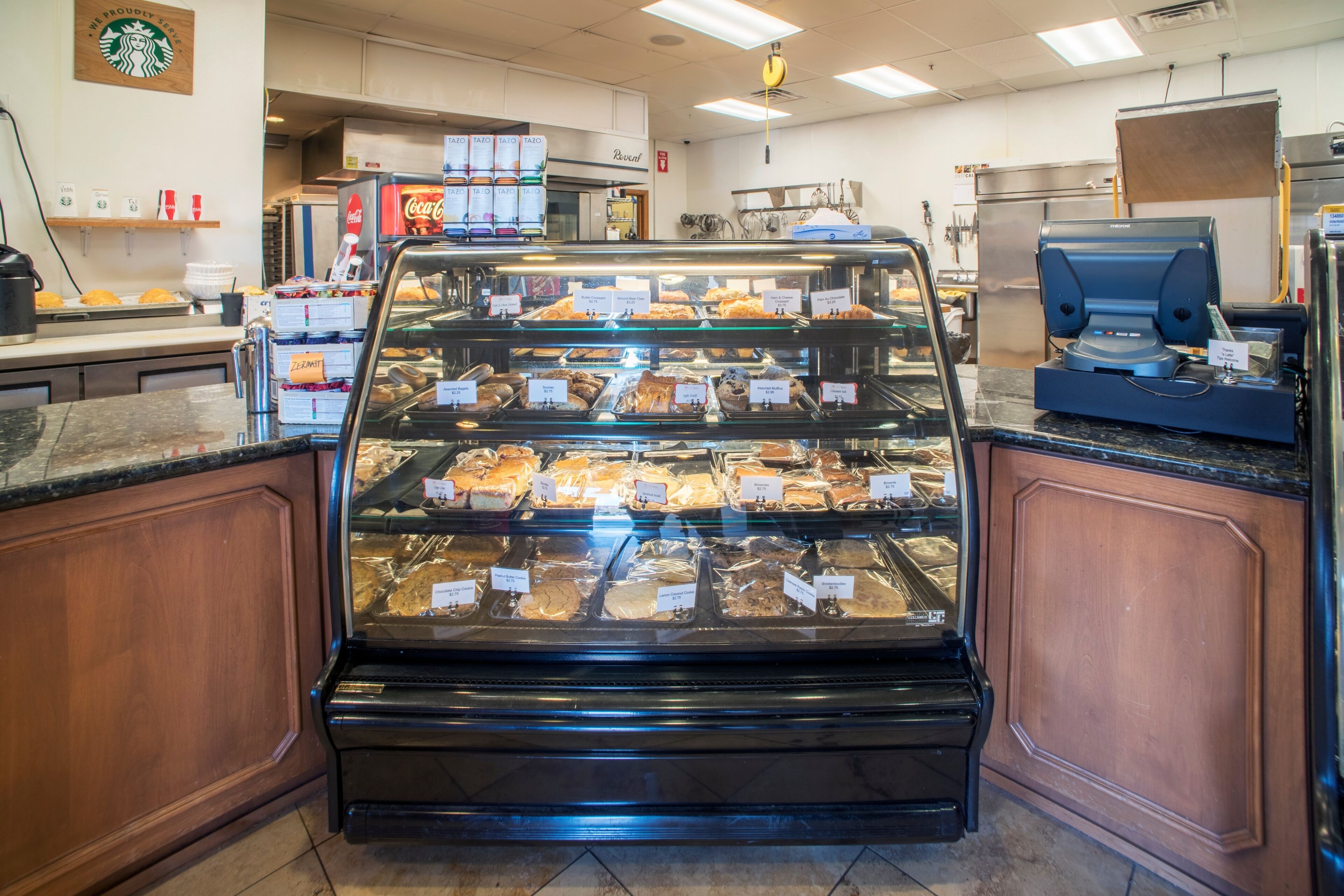A bakery display case with various baked goods.
