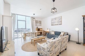 TV - Free housekeeping visits during your stay - StayShort - Cozy 2BR Retreat in Dubai South Near Expo City (Dubai South)