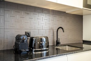 Fridge, microwave, stovetop, coffee/tea maker